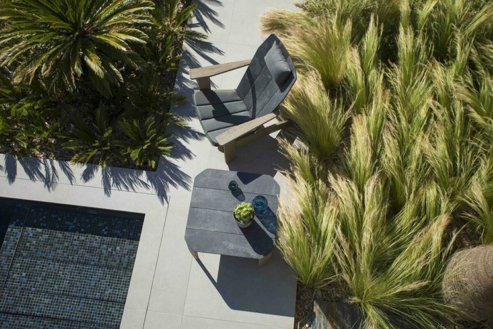 The Copenhague Adirondack Outdoor Chair by Les Jardins is designed for comfort and relaxation.