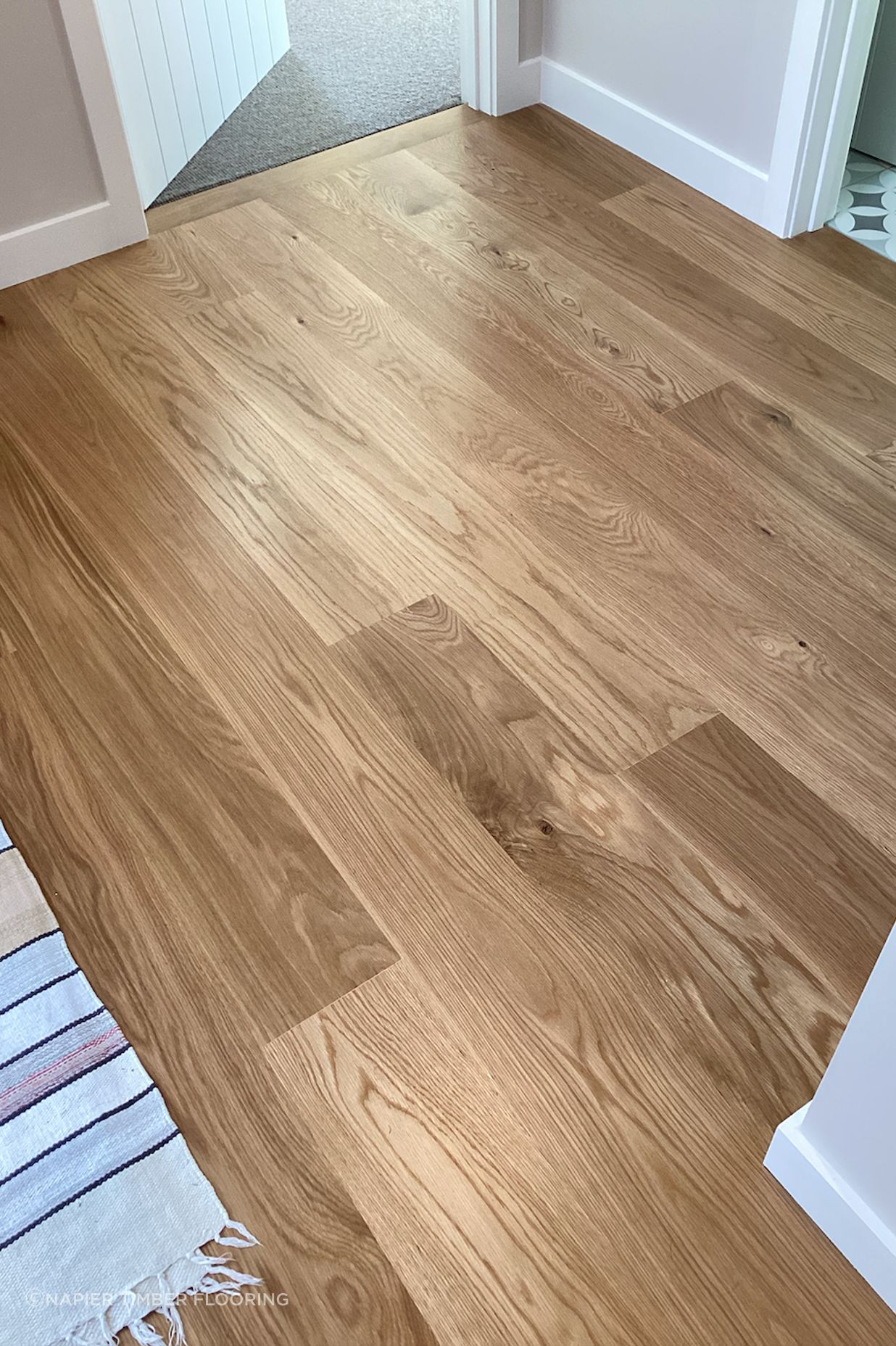 American white oak coated with polyurethane.