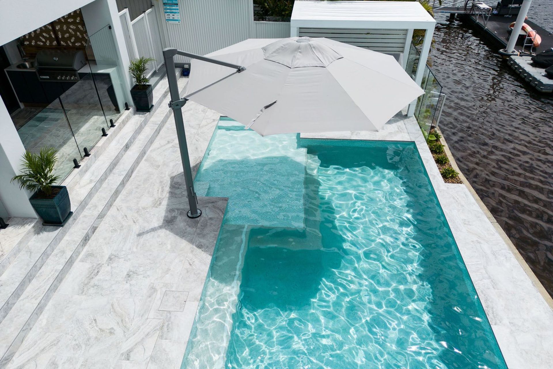 Platinum travertine complements a sleek, modern aesthetic.