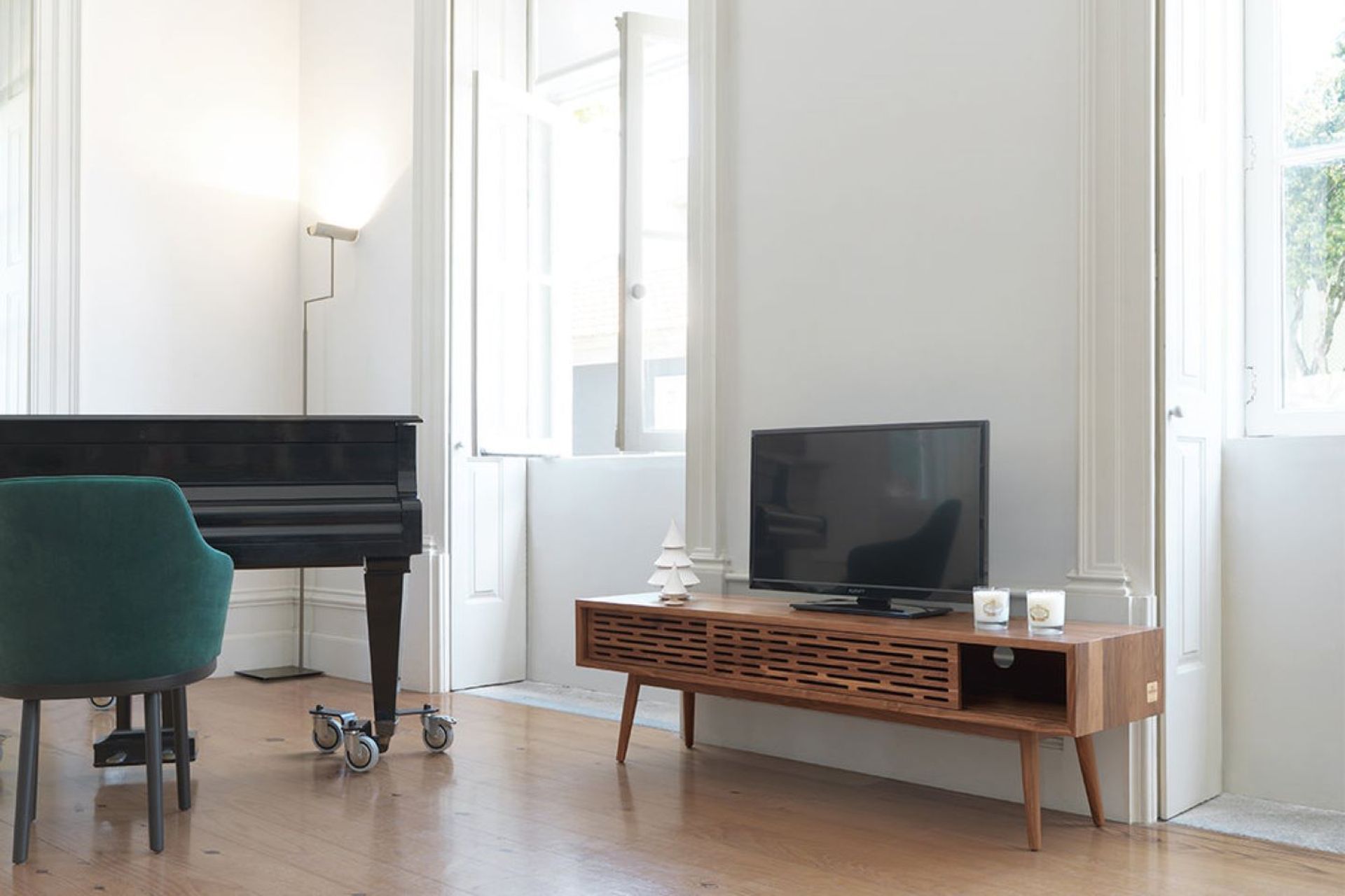 The visually elegant perforated sliding doors of the ALF Italia Novecento TV Cabinet are a great design feature.