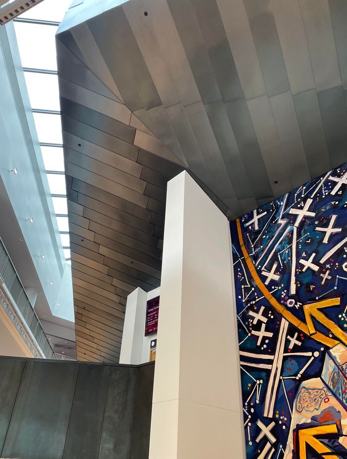 Diagonal lines of the cladding that run seamlessly through the skylight glazing from inside to outside.