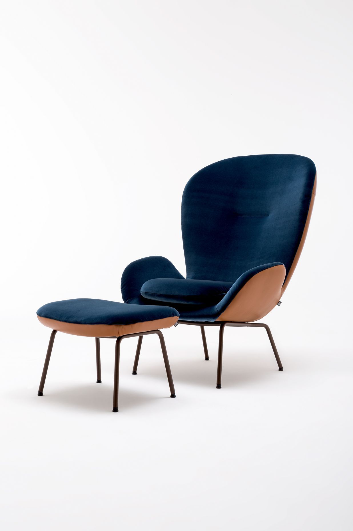 The Rolf Benz 594 high-back armchair is an eye-catching statement whose soft lines offer a visual clue to its particularly soft, light upholstery, while its finely balanced back curve embraces its occupant.