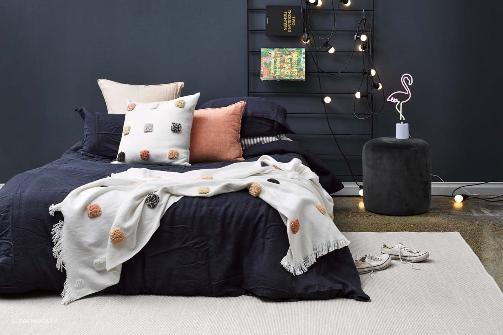 The Tussore Rug by Bremworth adds a touch of warmth and texture, enhancing the modern bedroom with its inviting, natural feel