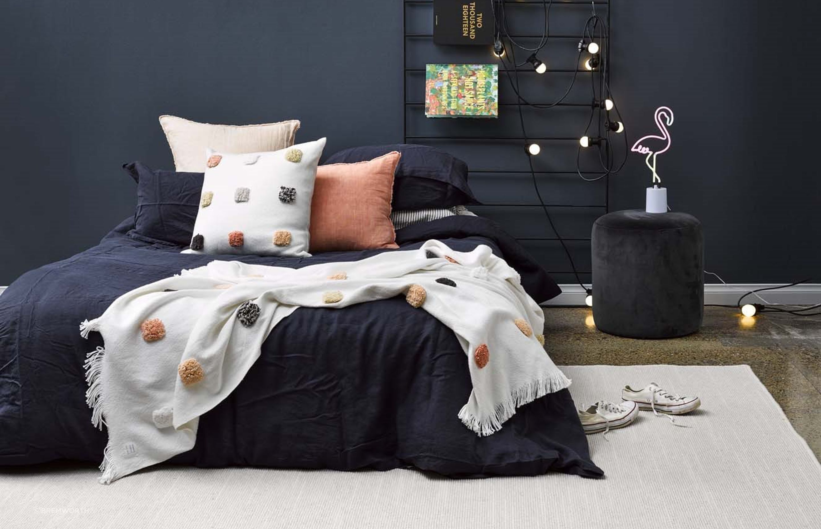 The Tussore Rug by Bremworth adds a touch of warmth and texture, enhancing the modern bedroom with its inviting, natural feel