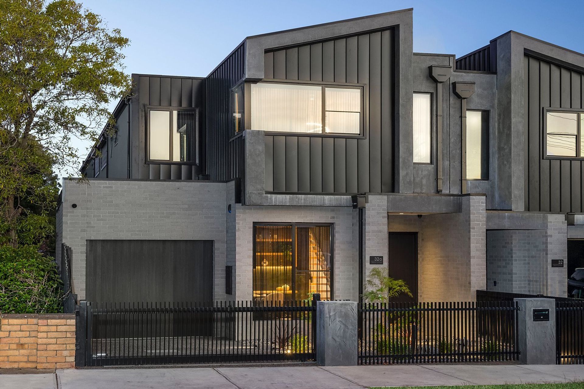 Singe lock cladding provides this townhouse with a clean, sleek finish. Featured product: Standing Seam Cladding.