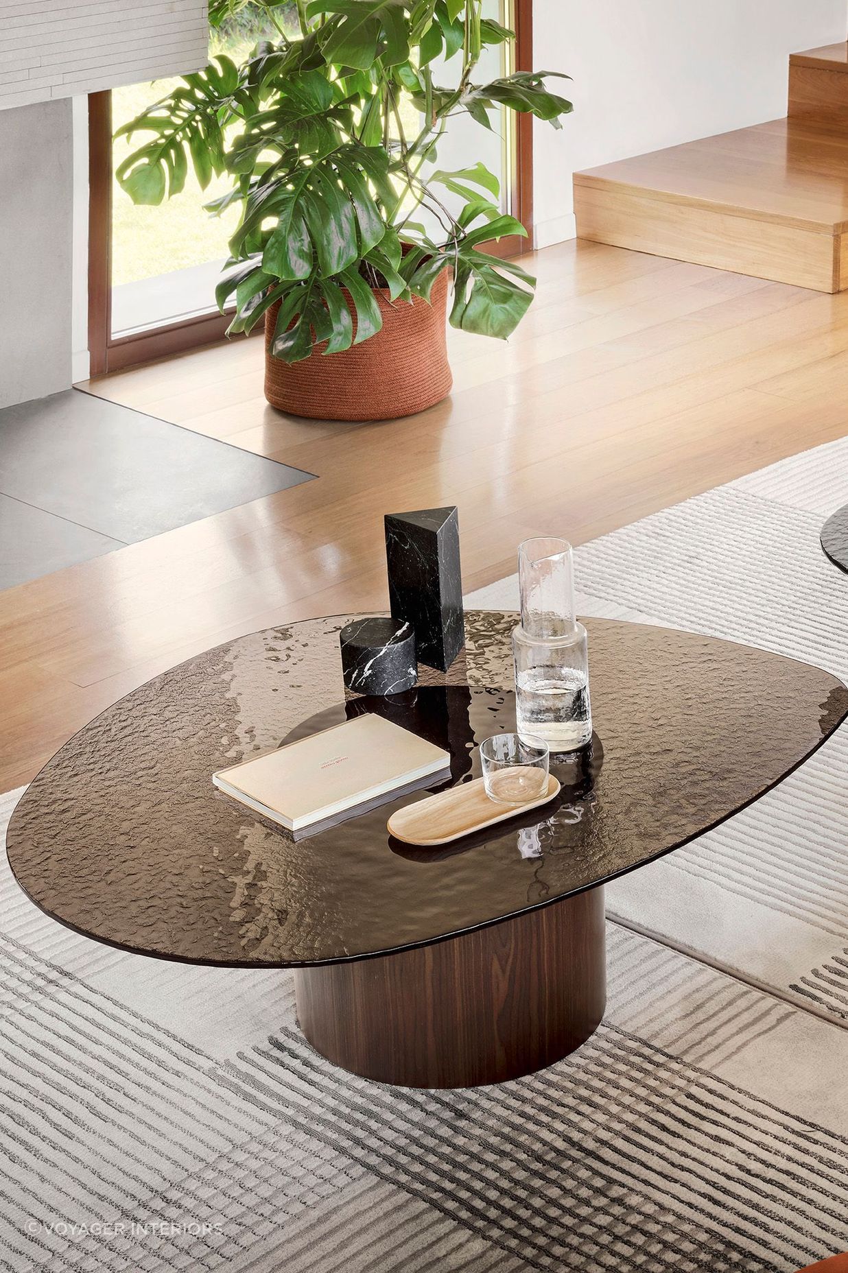 This textured glass tabletop brings this coffee table a unique look and texture.