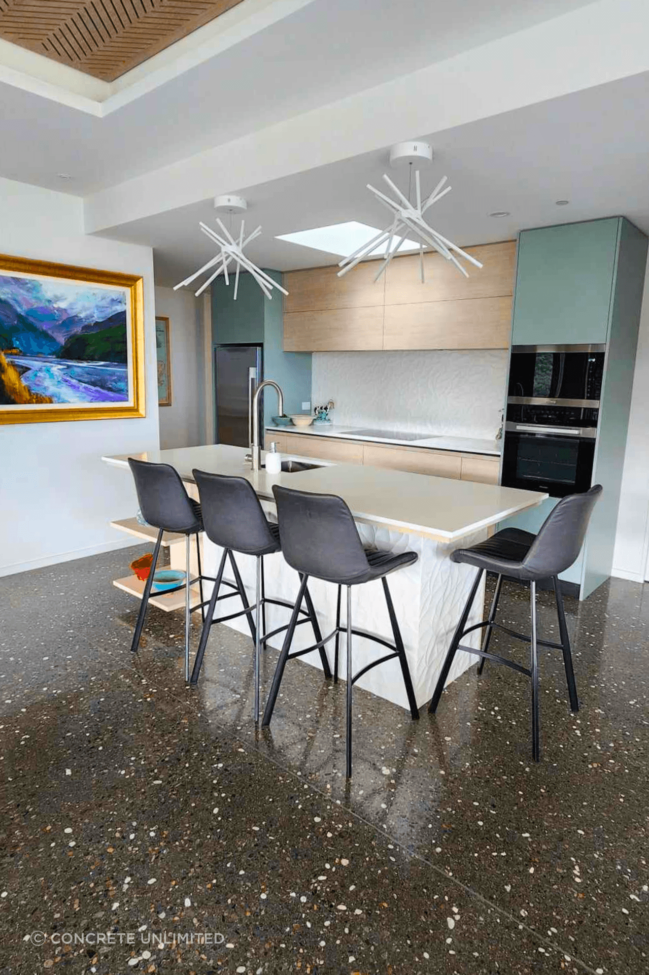 Polished concrete floors are a great way to bring a unique blend of style and functionality to the interior of your home, as featured in the Skylark Rise project