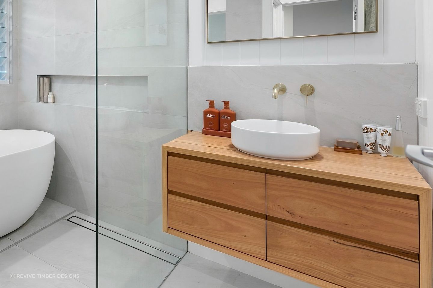 A wooden bathroom vanity can bring instant warmth into a space. Featured Product: Handcrafted Lily Vanity
