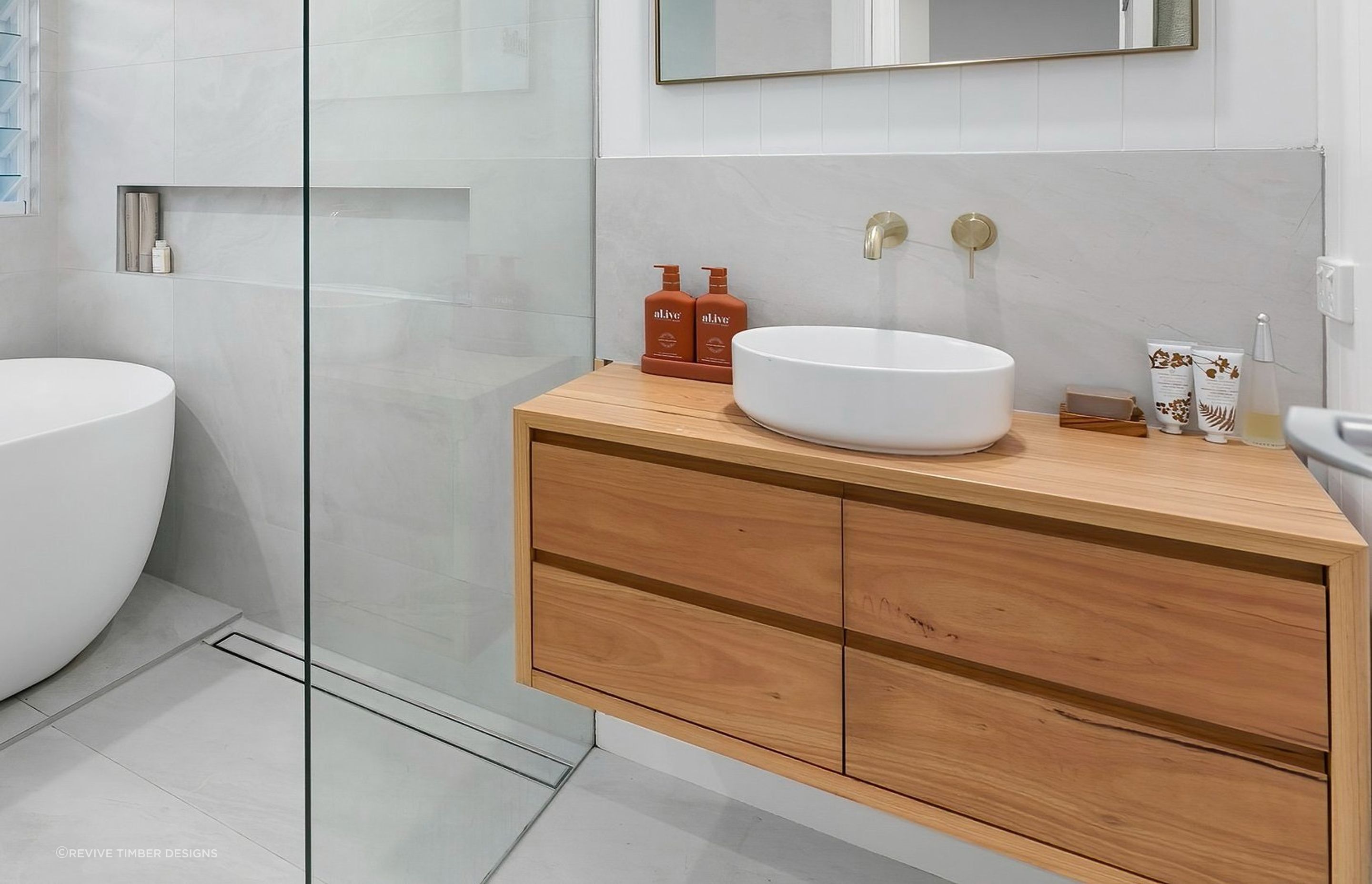 A wooden bathroom vanity can bring instant warmth into a space. Featured Product: Handcrafted Lily Vanity