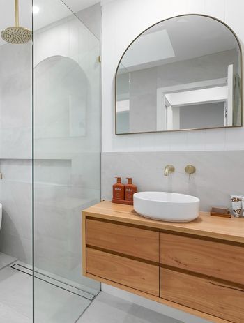 A wooden bathroom vanity can bring instant warmth into a space. Featured Product: Handcrafted Lily Vanity