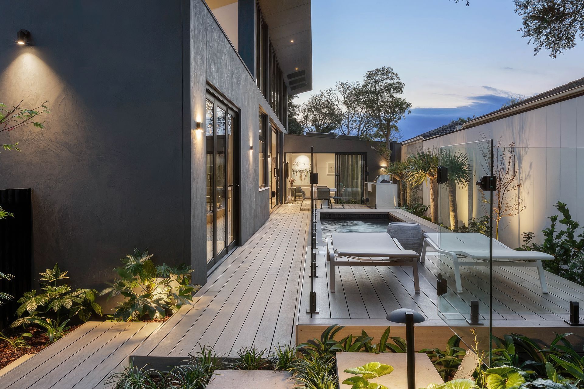 Incorporating greenery into your deck design, seen here in this deck made from CasaDeck by Outdure, will put you in one with nature.