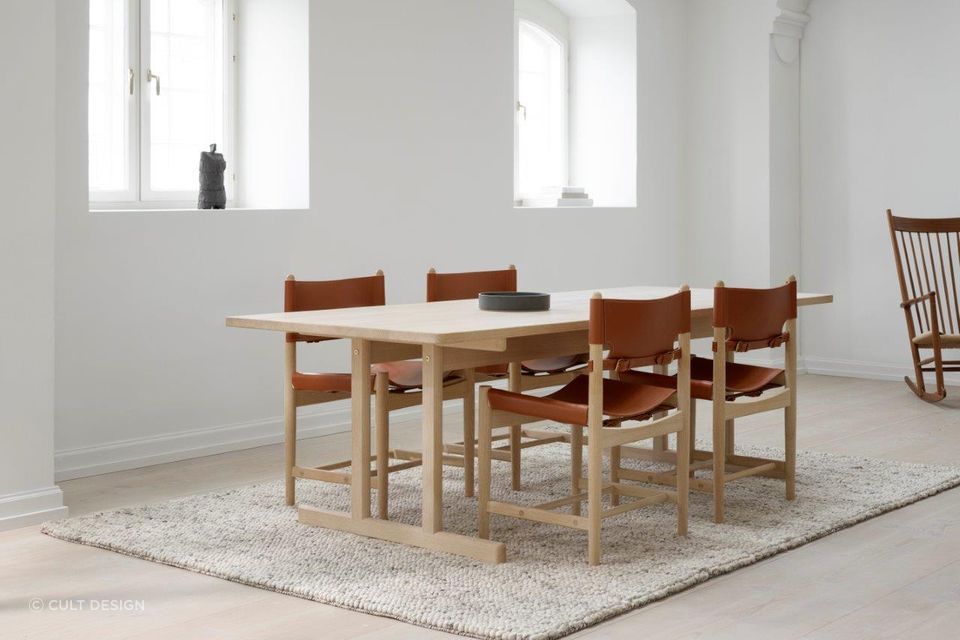 Having a rug that's the same shape as the dining table can help keep the interior design of a room consistent. Featured product: 6286 Dining Table.