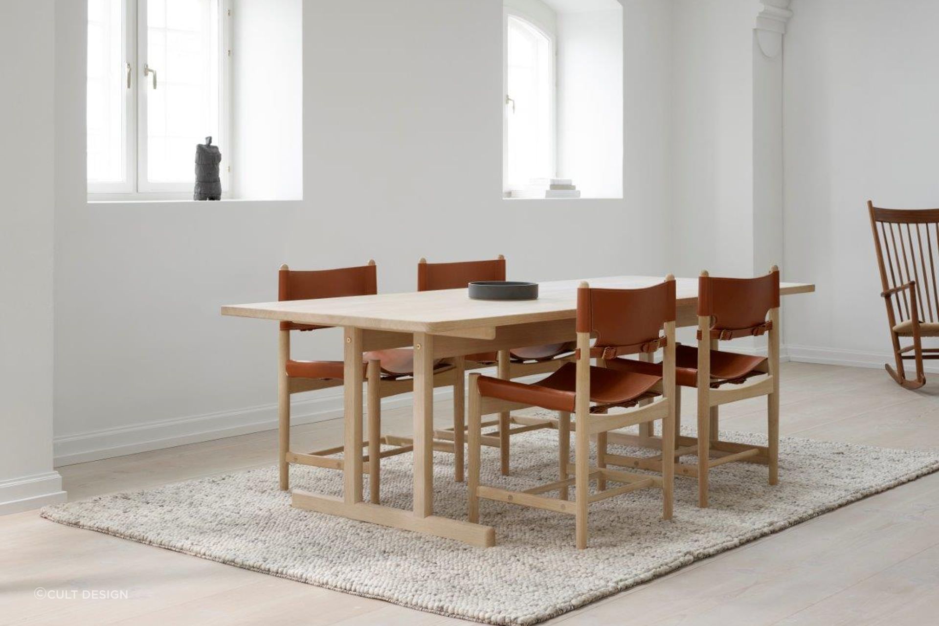 Having a rug that's the same shape as the dining table can help keep the interior design of a room consistent. Featured product: 6286 Dining Table.