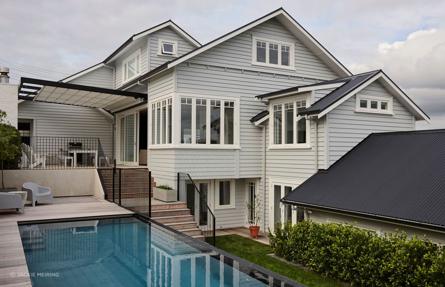 This bungalow renovation and extension in Northcote Point included a new top floor, extension and rebuild to existing addition of a garage, new outdoor living area and pool.