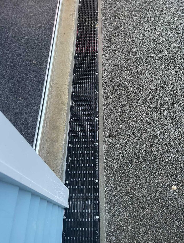 Channel drains are a common solution for existing homes.