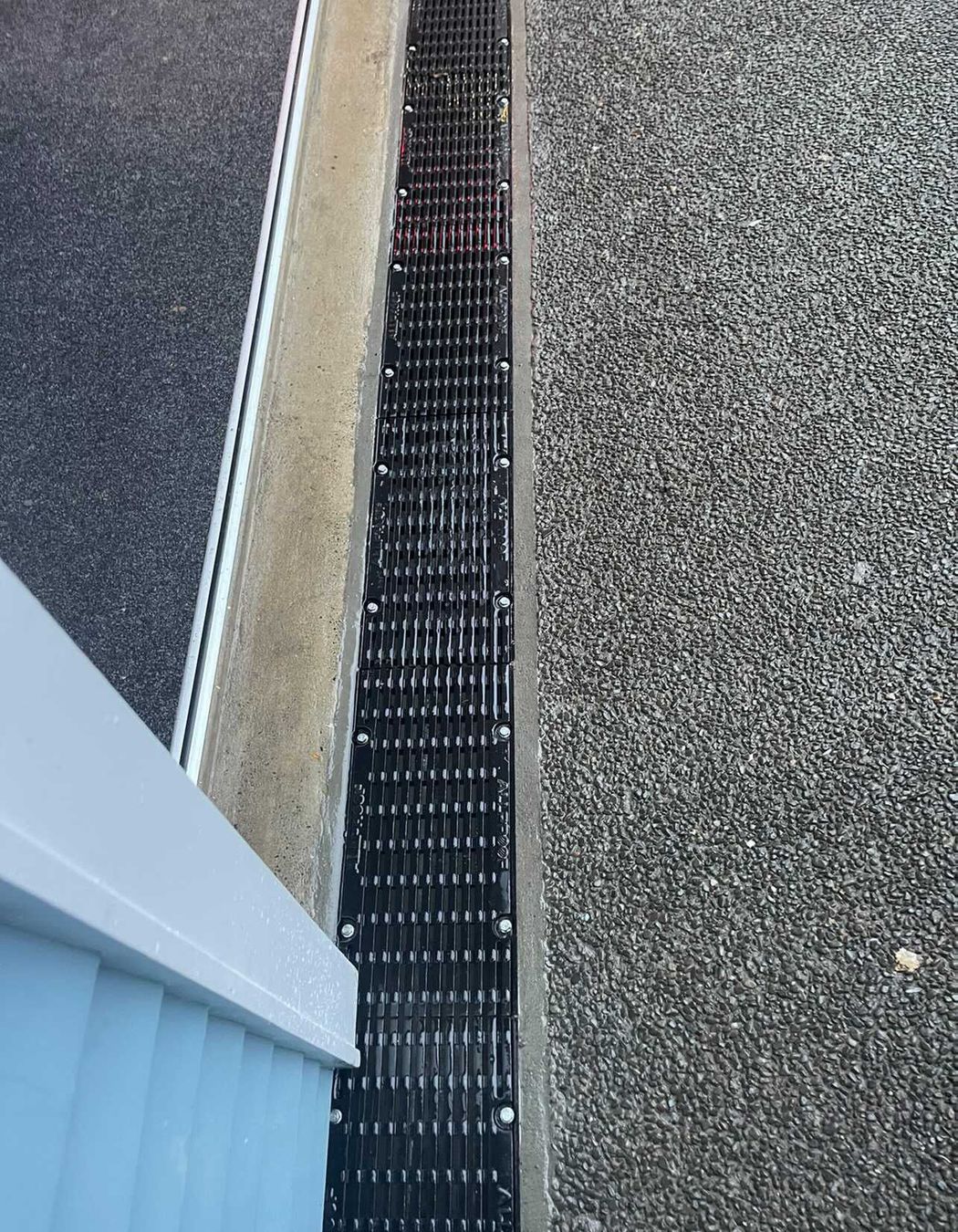 Channel drains are a common solution for existing homes.