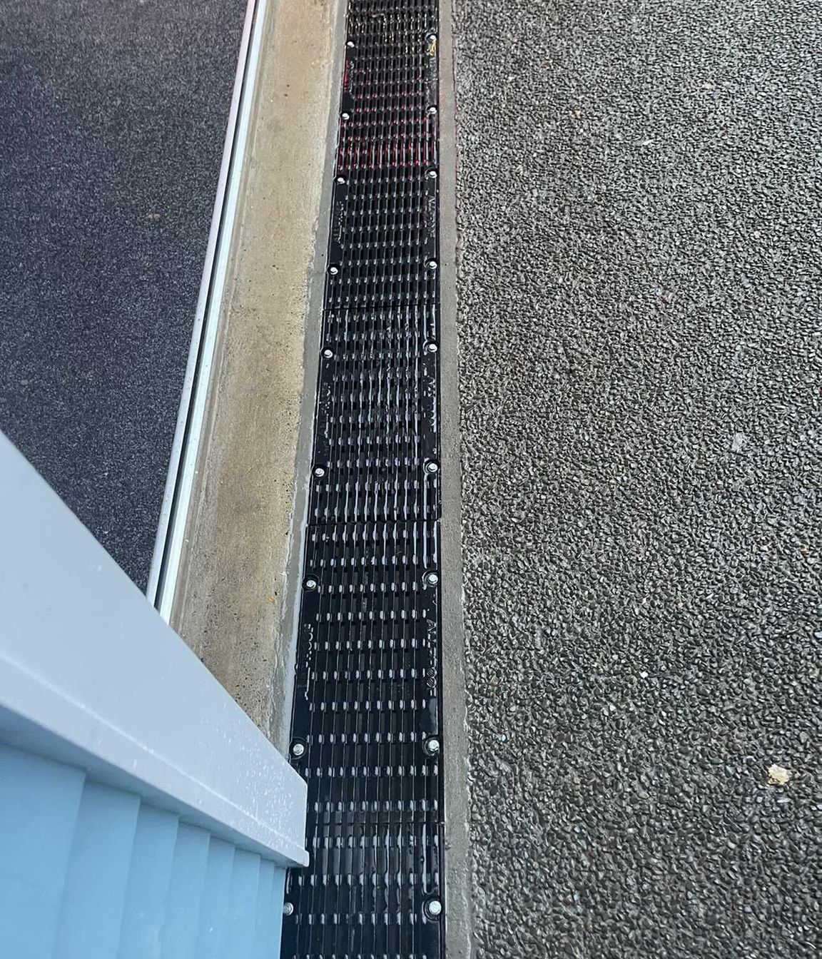 Channel drains are a common solution for existing homes.