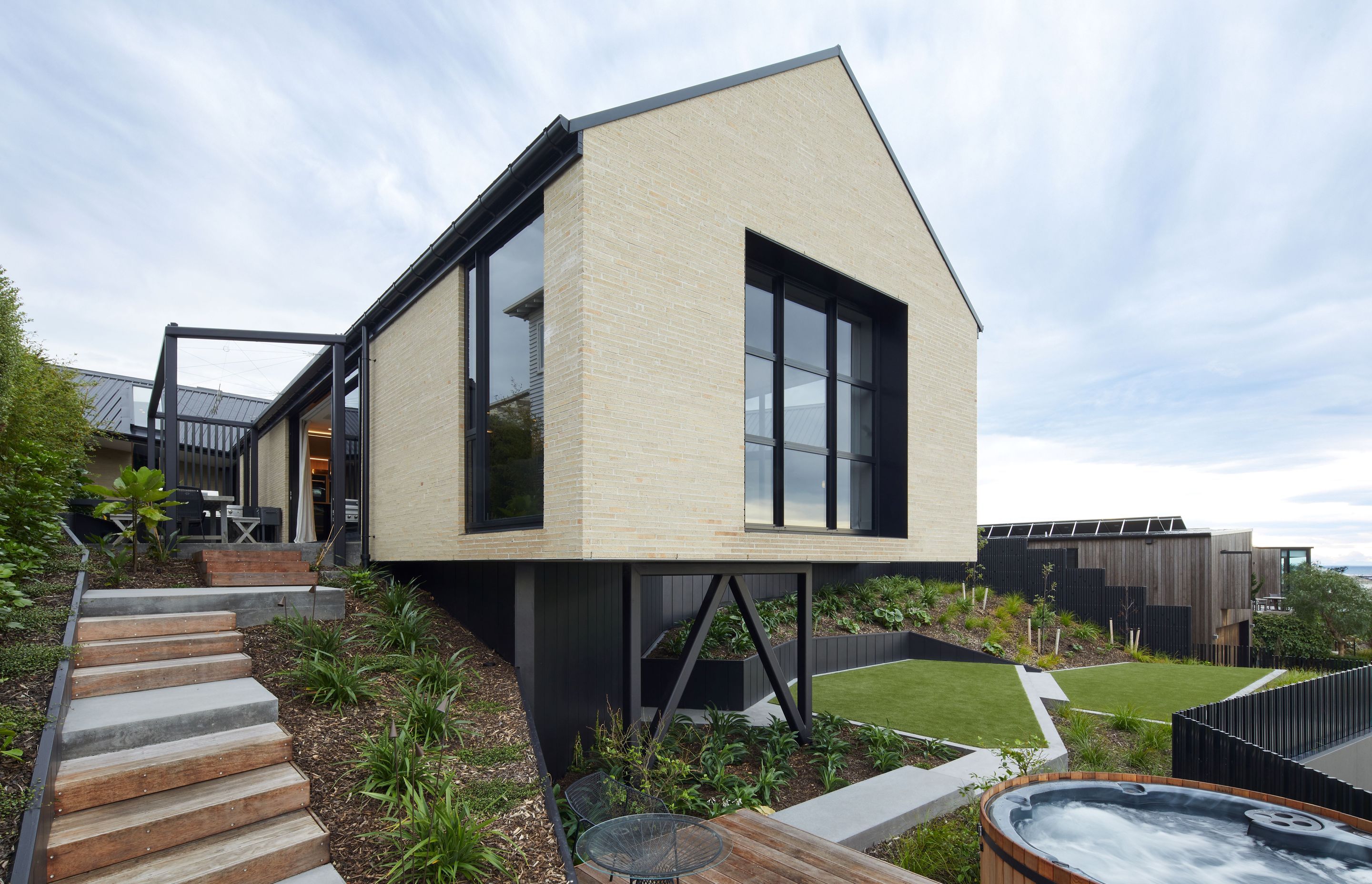 The exquisite, cantilevered design of this contemporary home constructed by DJ Hewitt Builders, shows how attention to detail can result in timeless architecture.