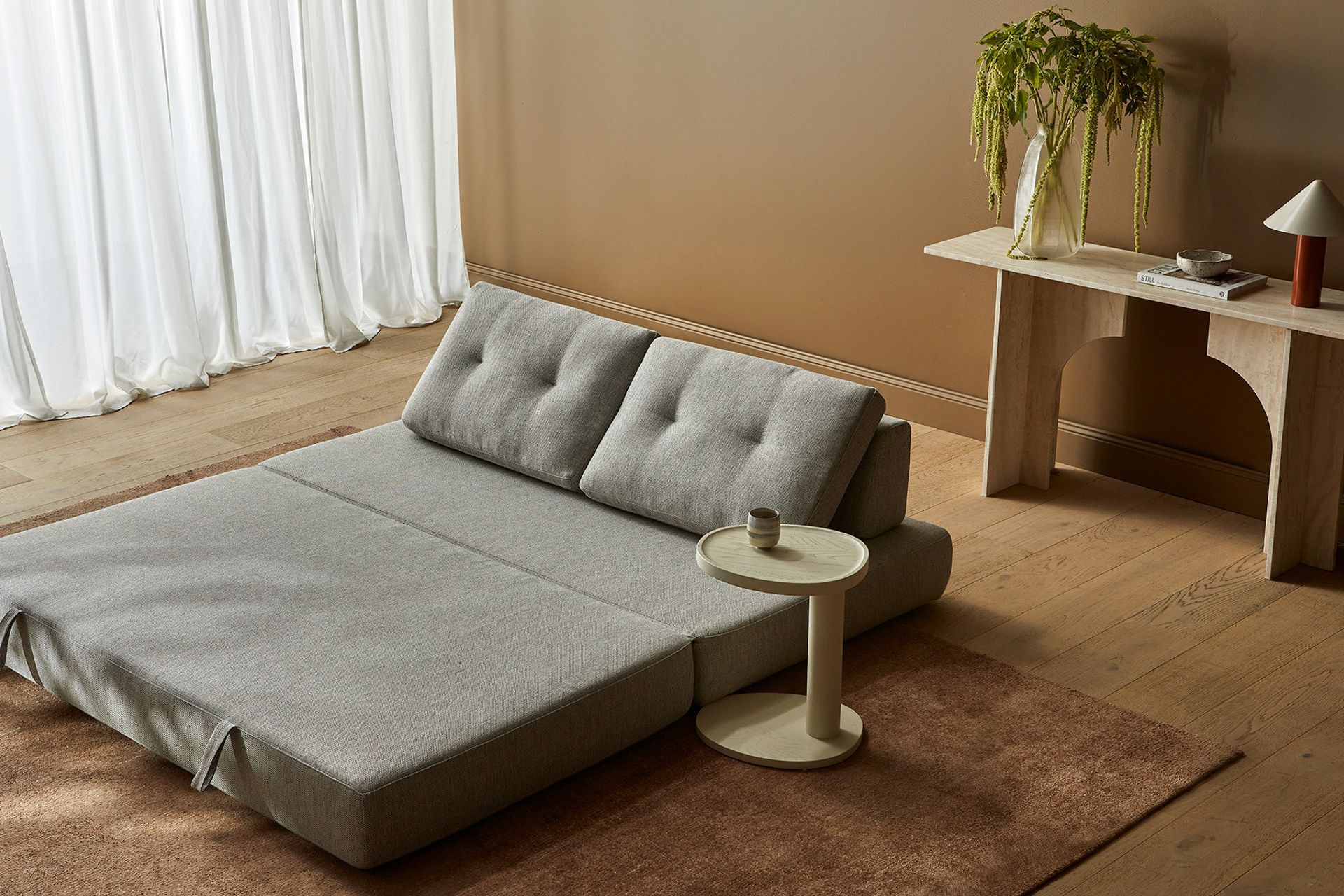 Pictured here: Hugo Gwen Sofa Bed, Archer Console Table, Tolv Islet Side Table, Easton Pinnacle Table Lamp, Boden Ridge Vase, Hanson Eden Set of 3 Bowls, Tepih Neptune Rug (Ginger)