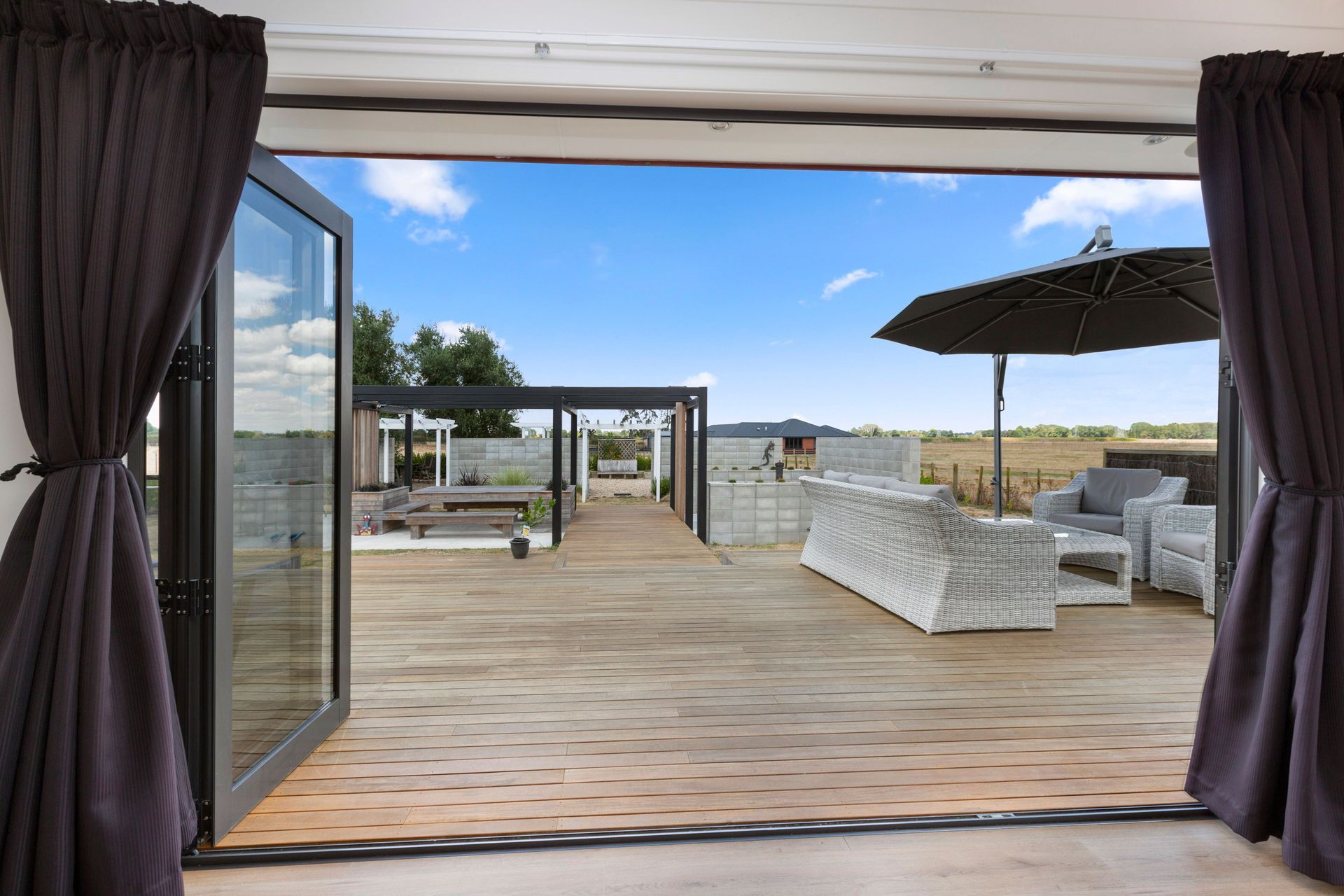 Bifold doors were installed, opening out onto a large Vitex deck for great indoor-outdoor flow.
