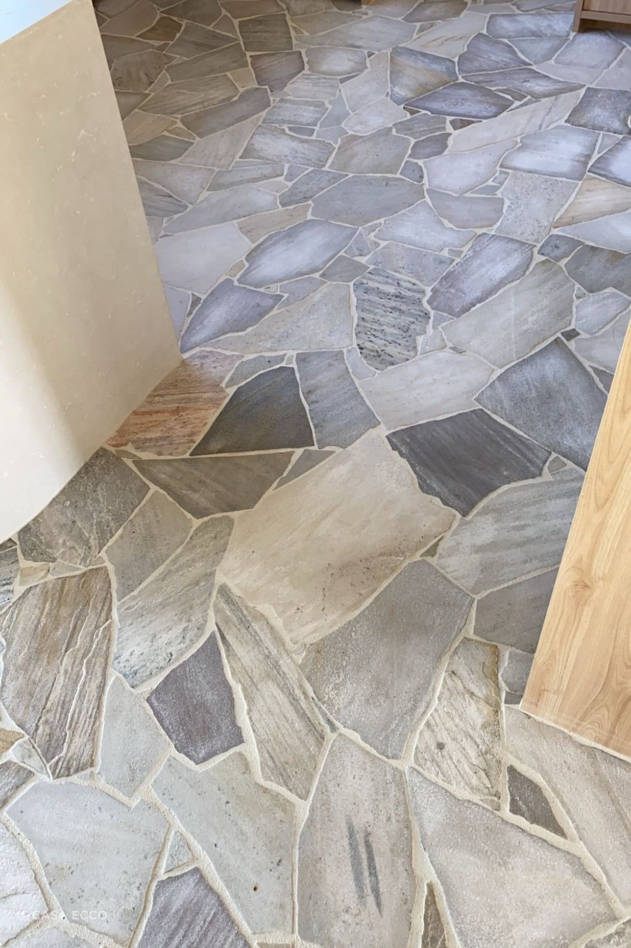 Complicated organic stone tiles need an experienced tiler to lay them.