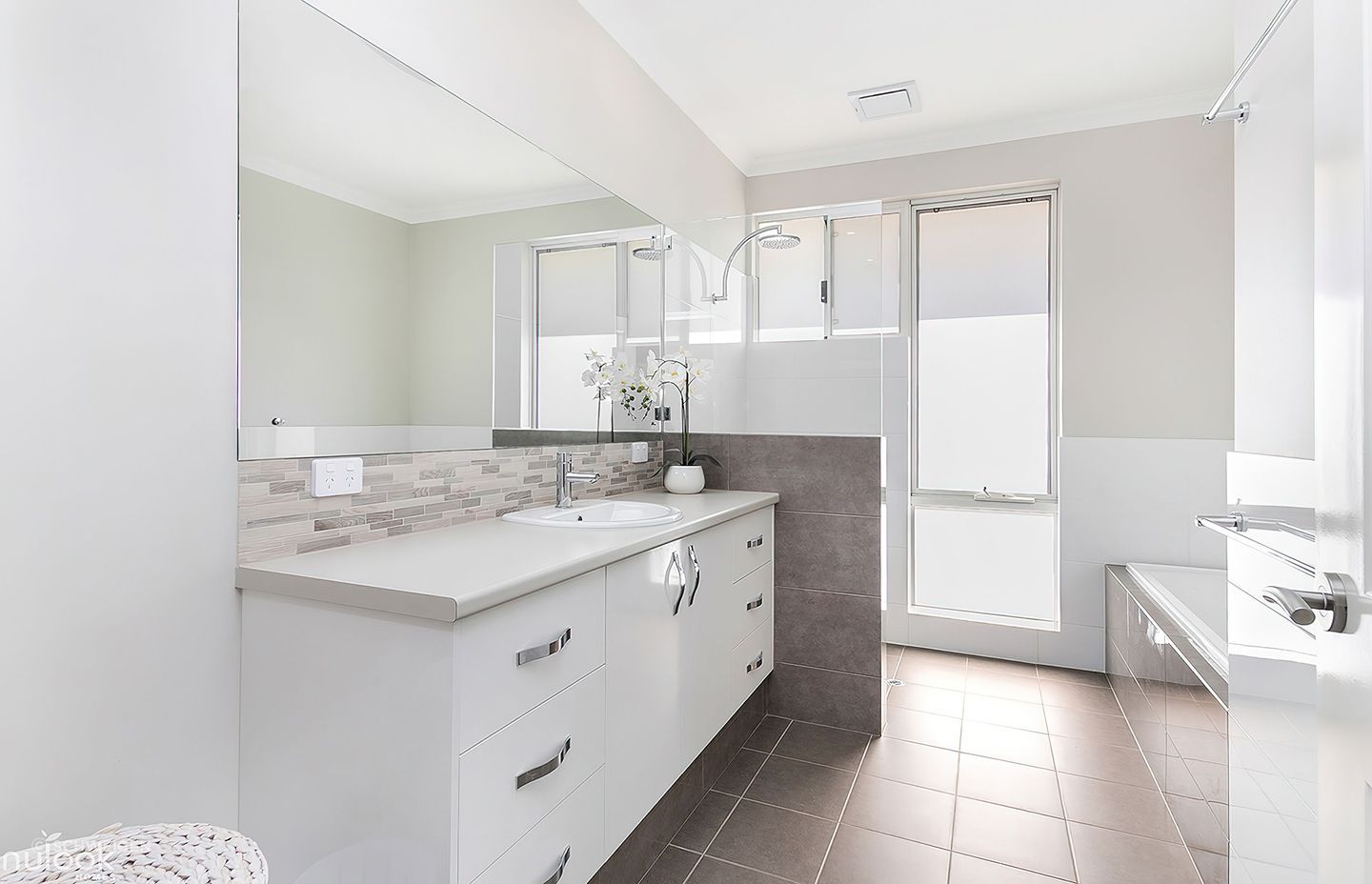 Manning Residence by Nulook Homes featuring the BRW652 Schweigen Silent Exhaust Fan for 2 Rooms.