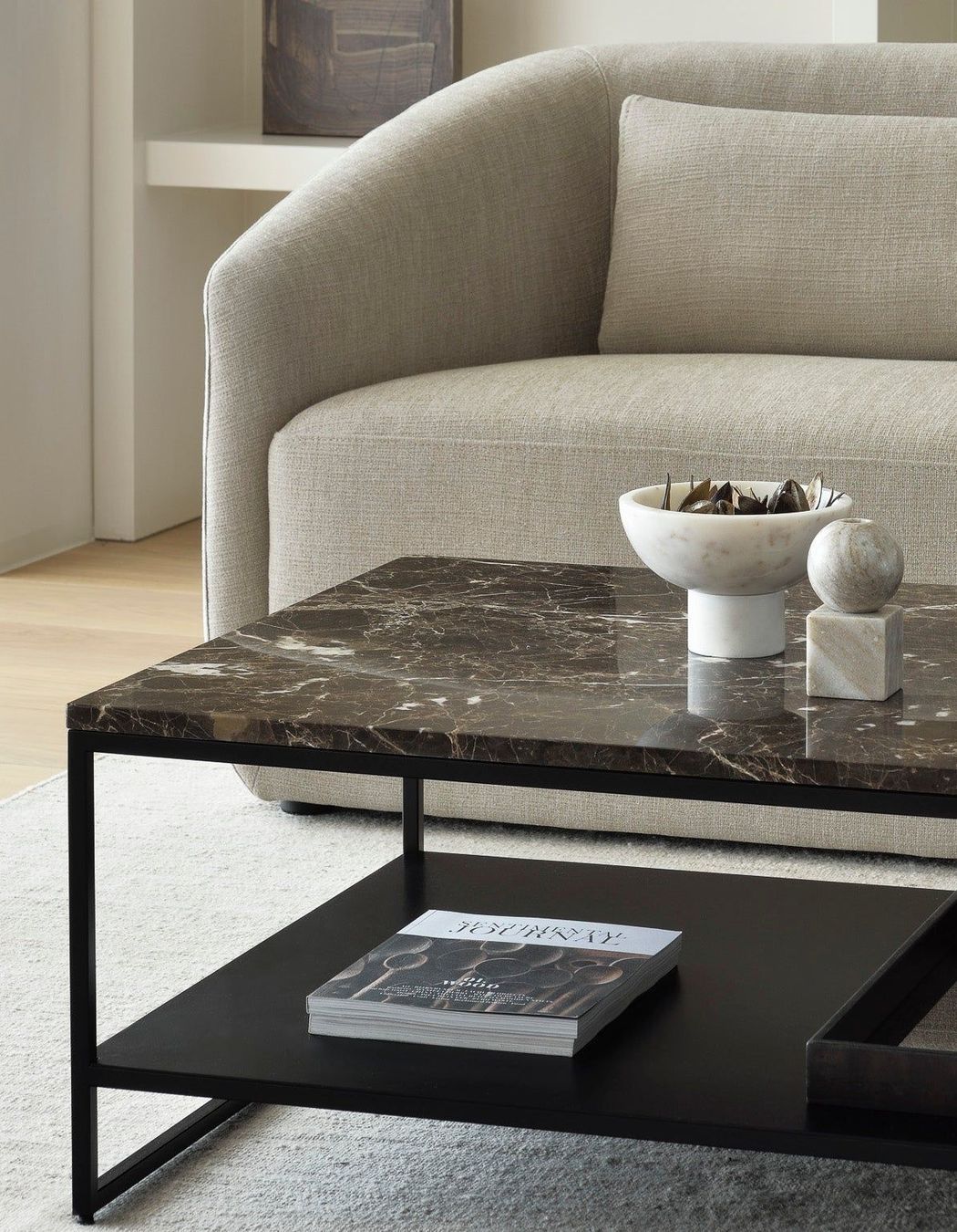 A polished marble coffee table stands as a statement piece in a living room.