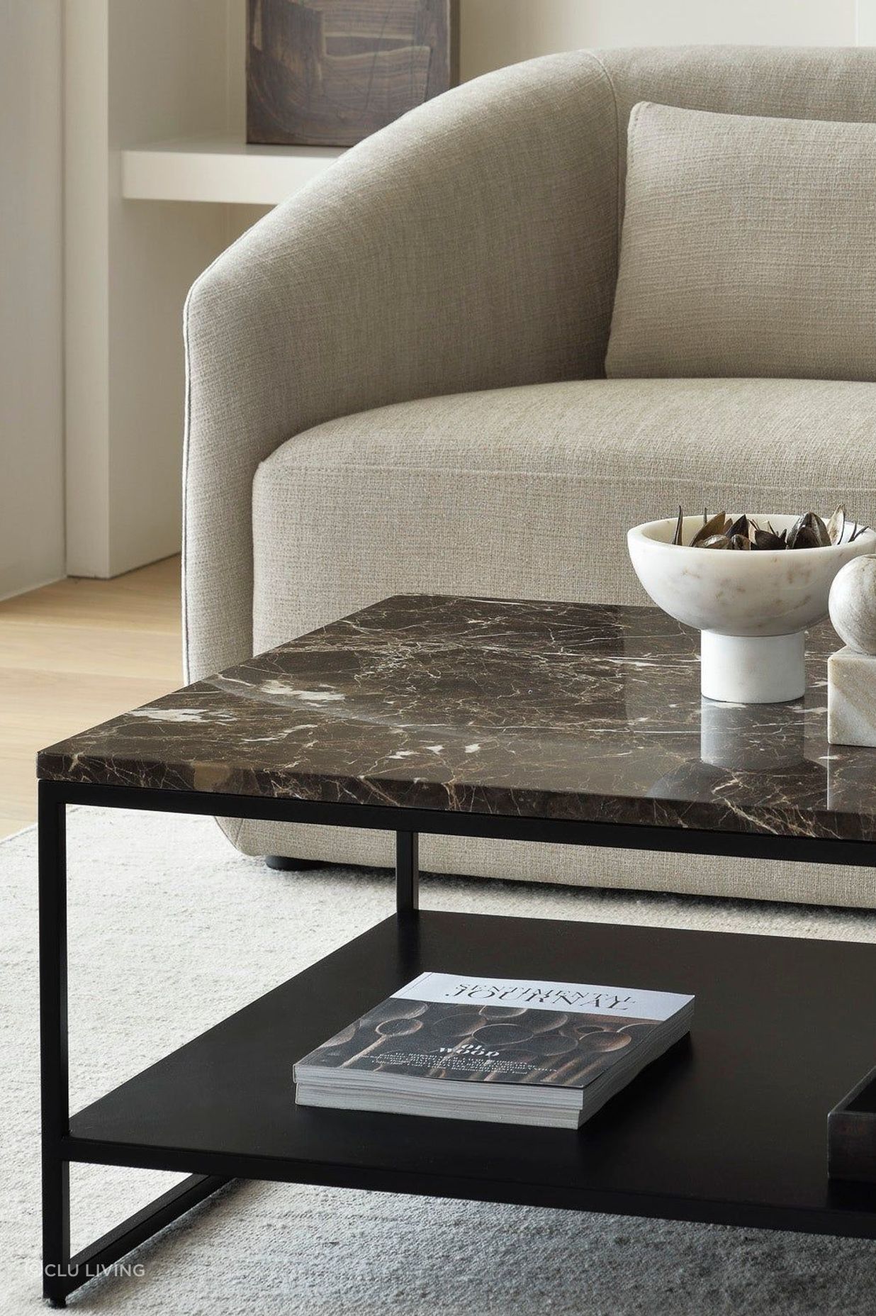 A polished marble coffee table stands as a statement piece in a living room.