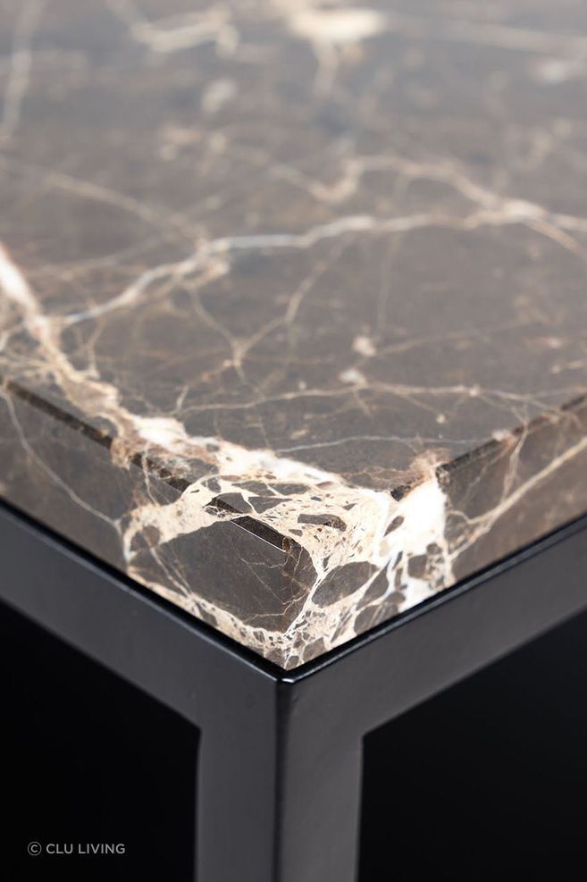 Marble is a common coffee table surface and showcases natural veining patterns.