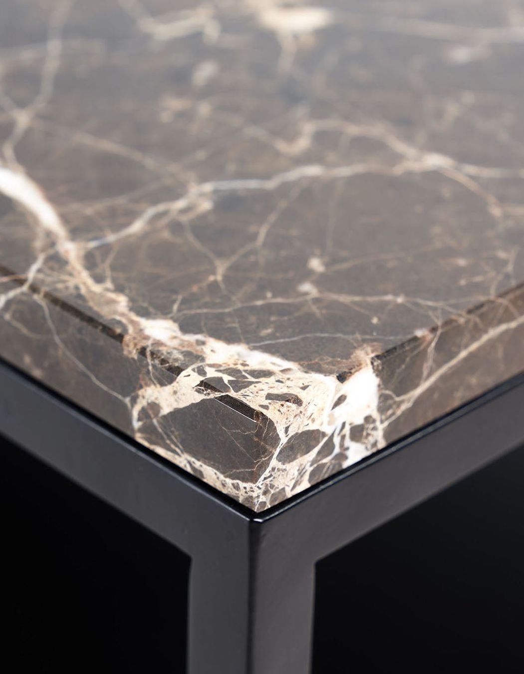 Marble is a common coffee table surface and showcases natural veining patterns.