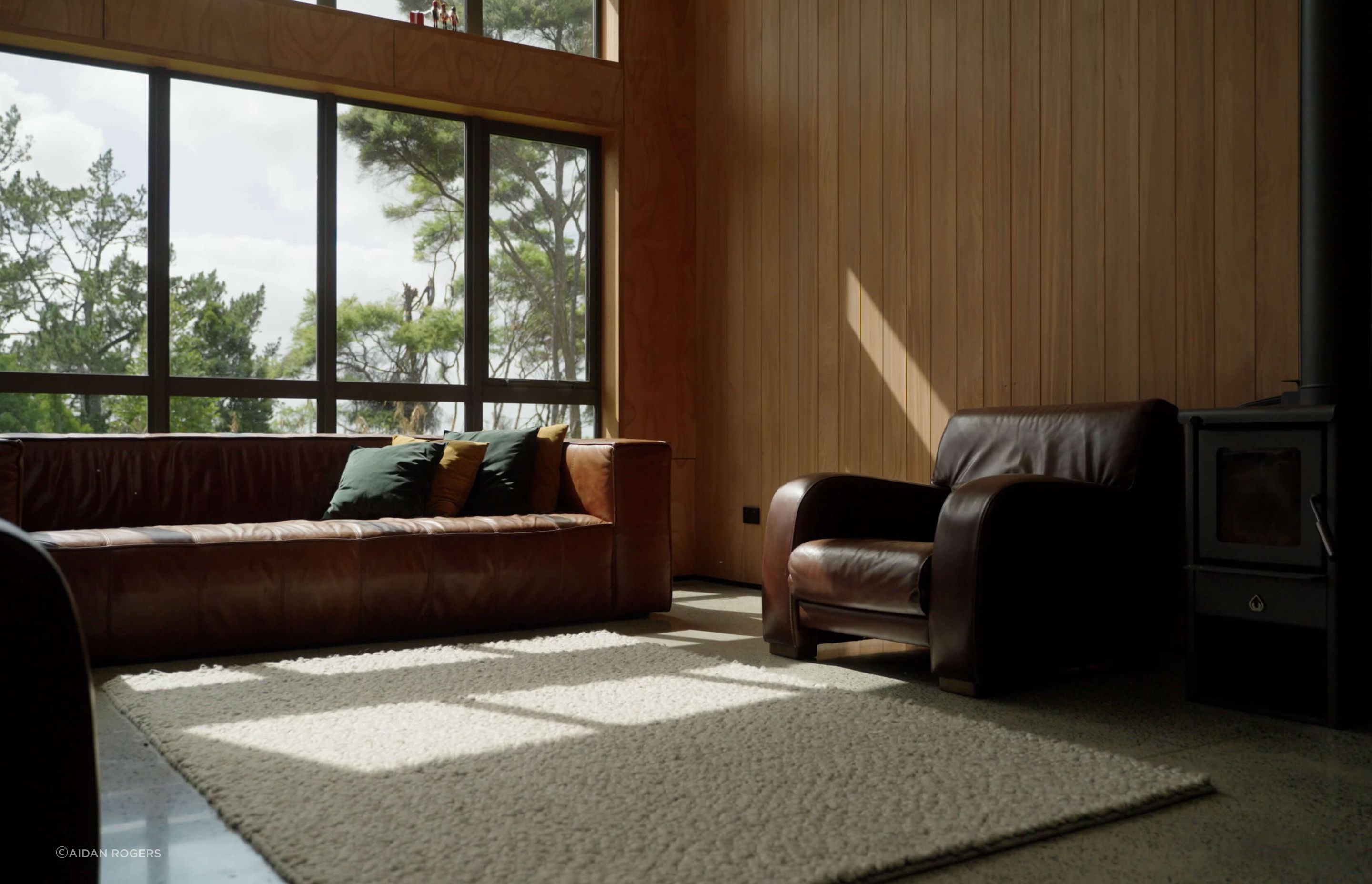 Cedar-lined walls, a freestanding fireplace and double-glazing give this lounge a cosy new vibe.