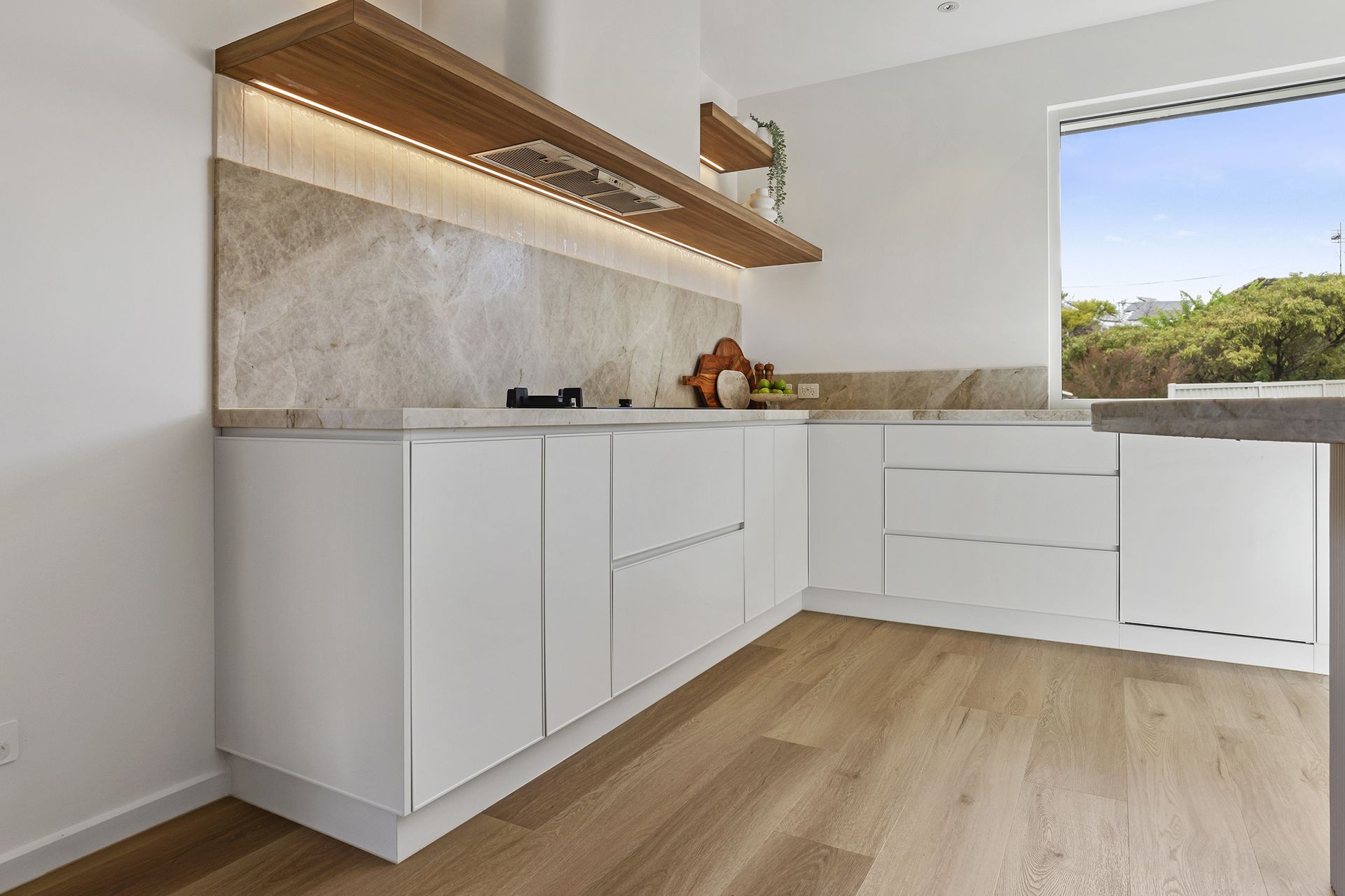 Project by Hallam Kitchens & Mitchwell Group featuring the Schweigen UM1170-9S Silent Undermount Rangehood. Photography by PBloc Media. Source publication: Kitchen & Bathrooms Magazine.