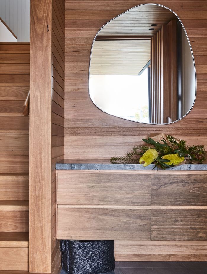 Combining textures, like the wood and stone seen here, will be key to interior design in 2024.