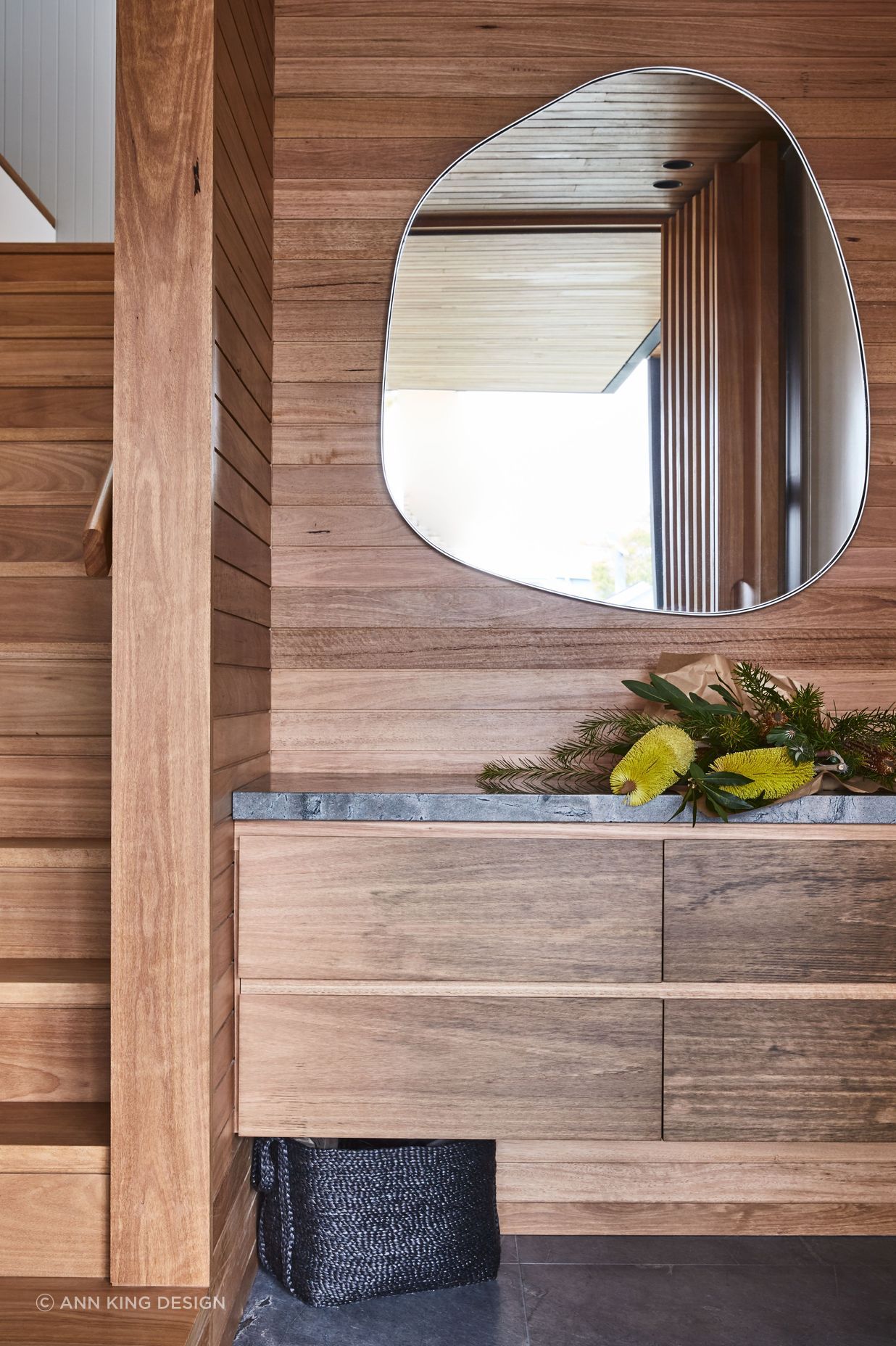 Combining textures, like the wood and stone seen here, will be key to interior design in 2024.