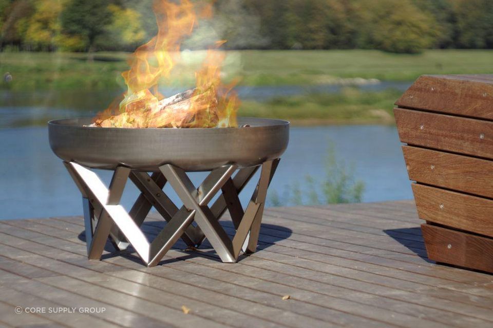 Hand-finished from solid steel, the Curion Fire Pit's natural rust patina offers a timeless aesthetic of pure elegance.