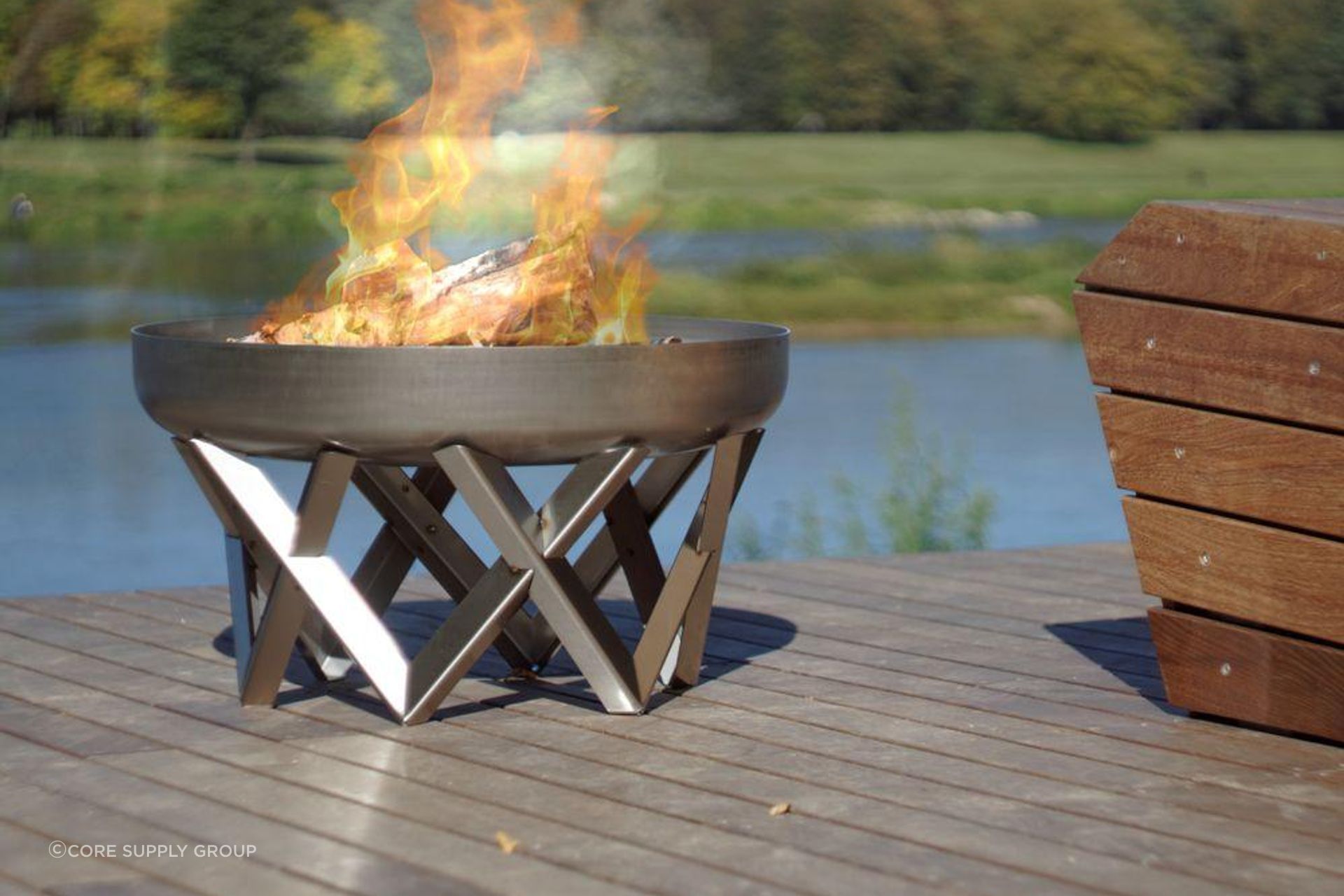 Hand-finished from solid steel, the Curion Fire Pit's natural rust patina offers a timeless aesthetic of pure elegance.