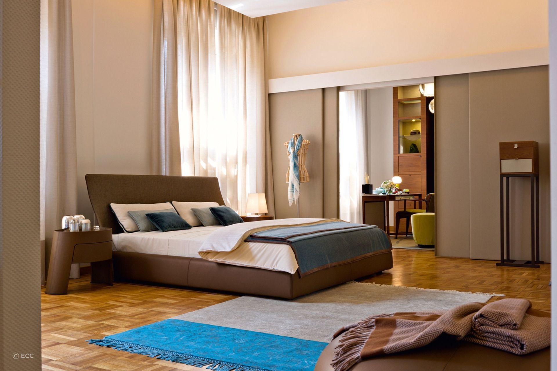 Your walls don't have to be completely white to create a brighter look in your bedroom, as shown here in this stylish space featuring the Altea Bed by Georgetti.
