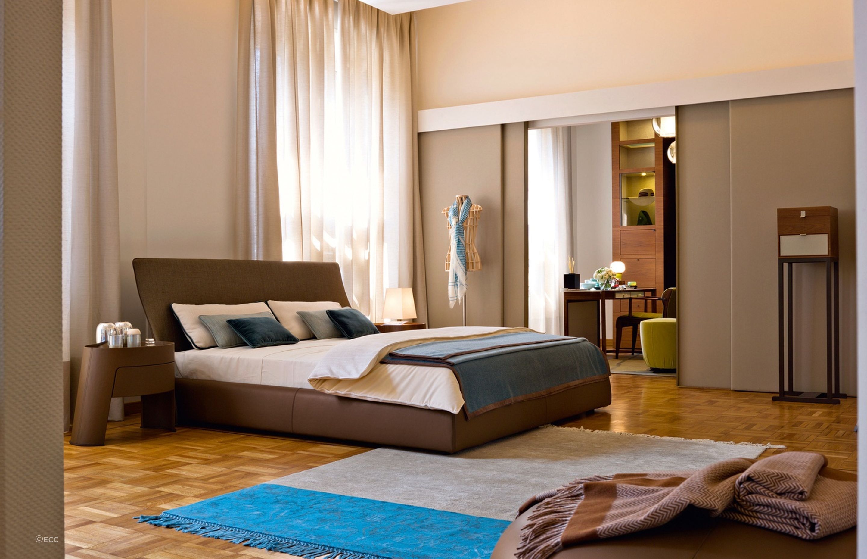 Your walls don't have to be completely white to create a brighter look in your bedroom, as shown here in this stylish space featuring the Altea Bed by Georgetti.
