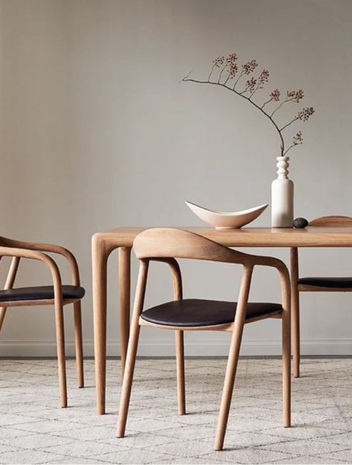 A decorative vase placed on a dining room table is a functional centrepiece.