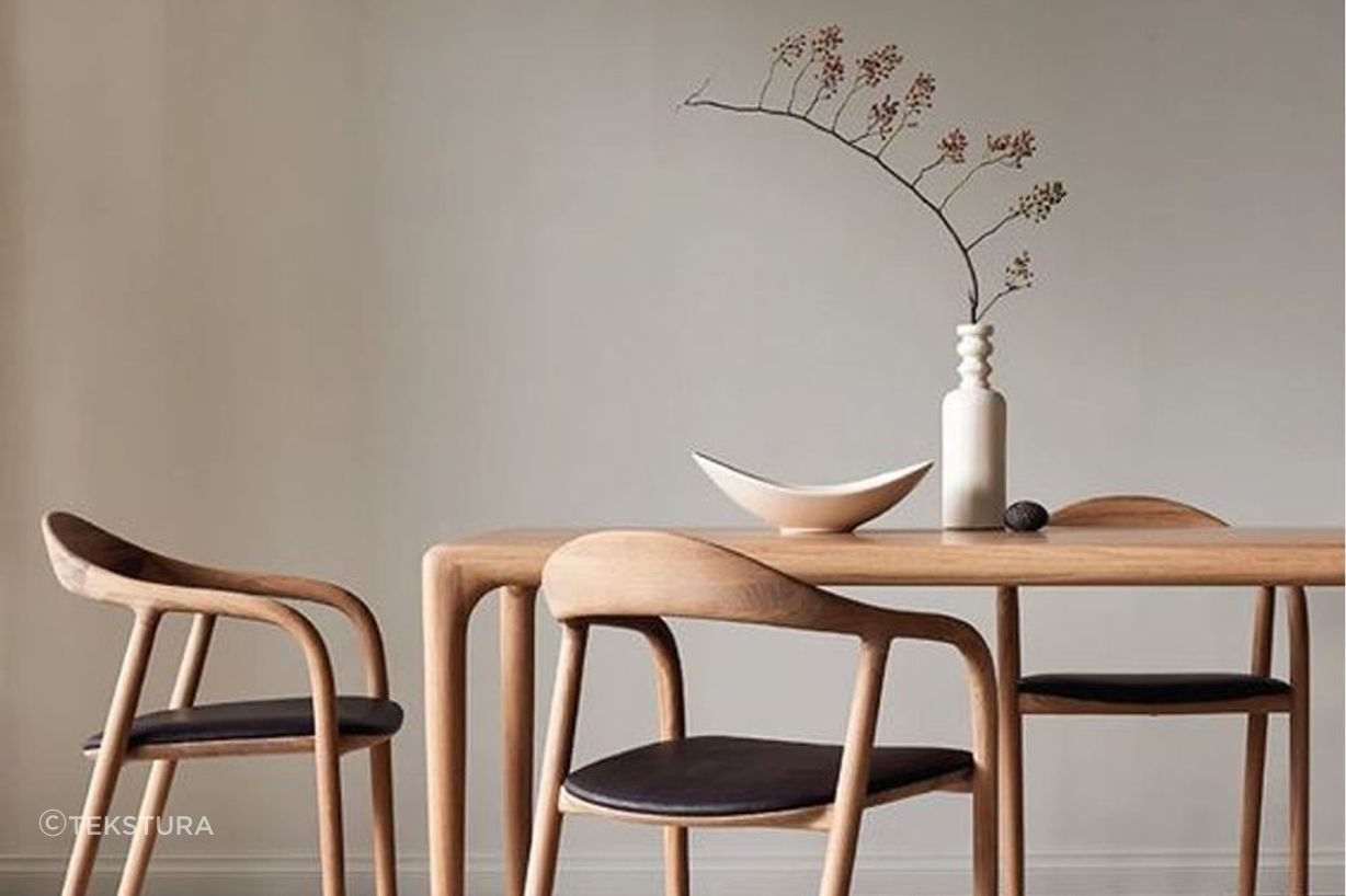 A decorative vase placed on a dining room table is a functional centrepiece.