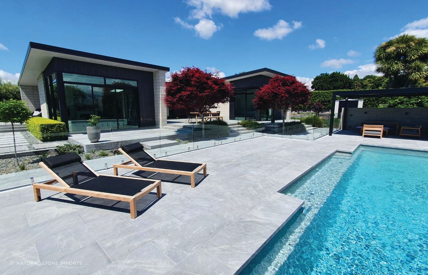 Durable and versatile, stone coping can be adapted to suit any pool design.