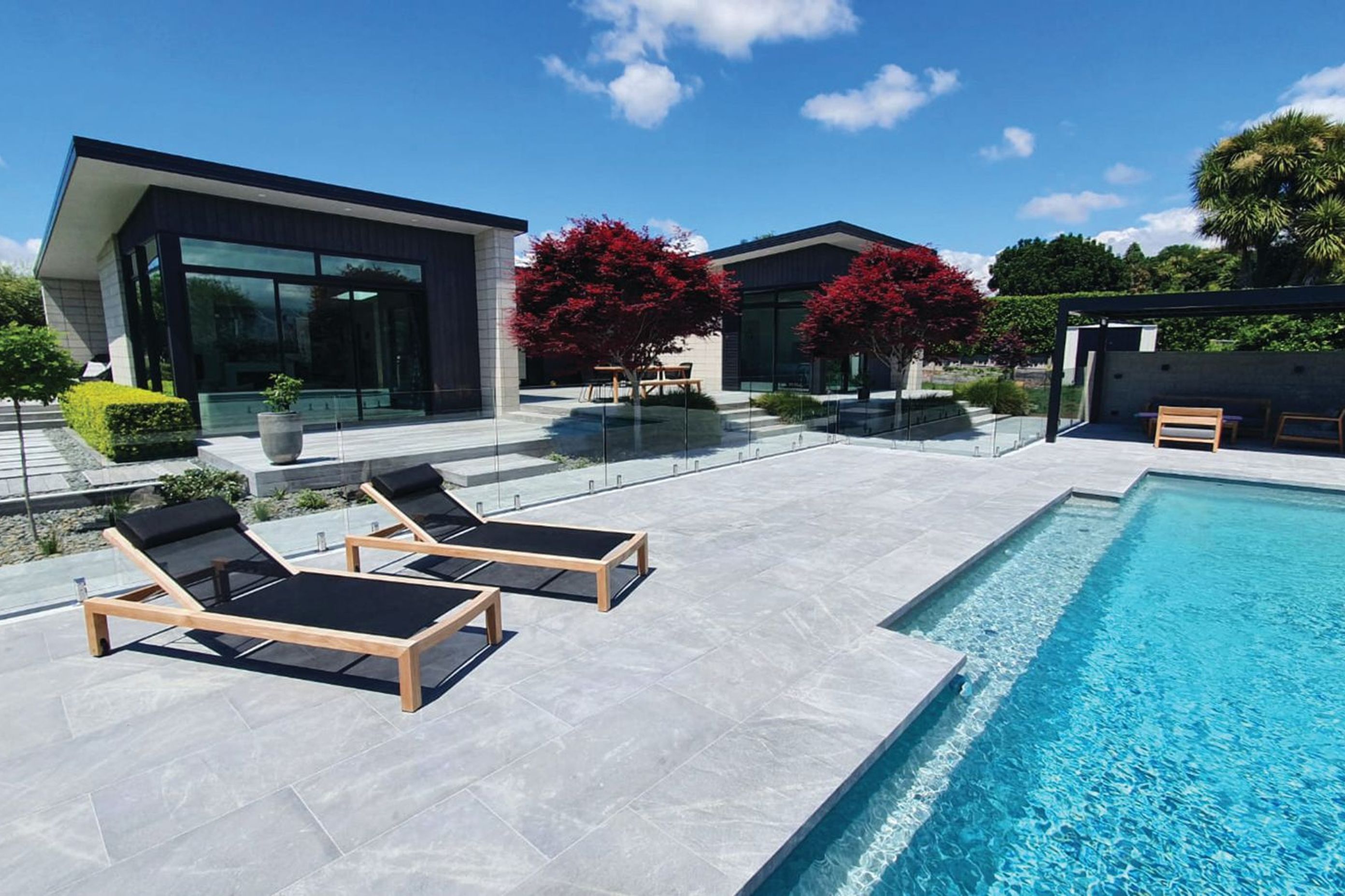 Durable and versatile, stone coping can be adapted to suit any pool design.