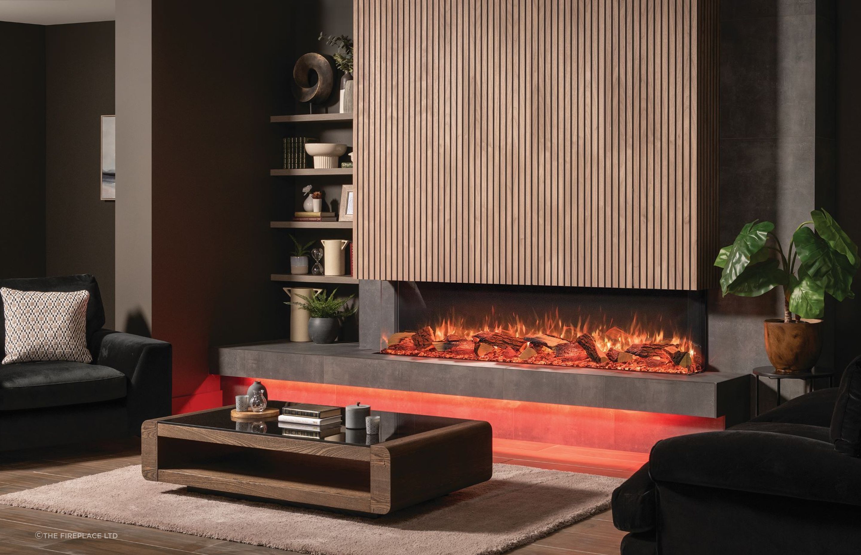 A fireplace, like this sophisticated Onyx Avanti Electric Fireplace, is just one way to create a focal point in a living room.