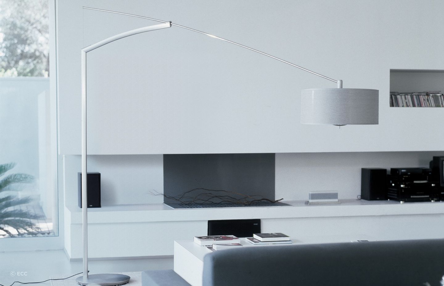 A stunning floor lamp like the Balance Floor Lamp by Jordi Viladrell for Vibia can bring a room together.