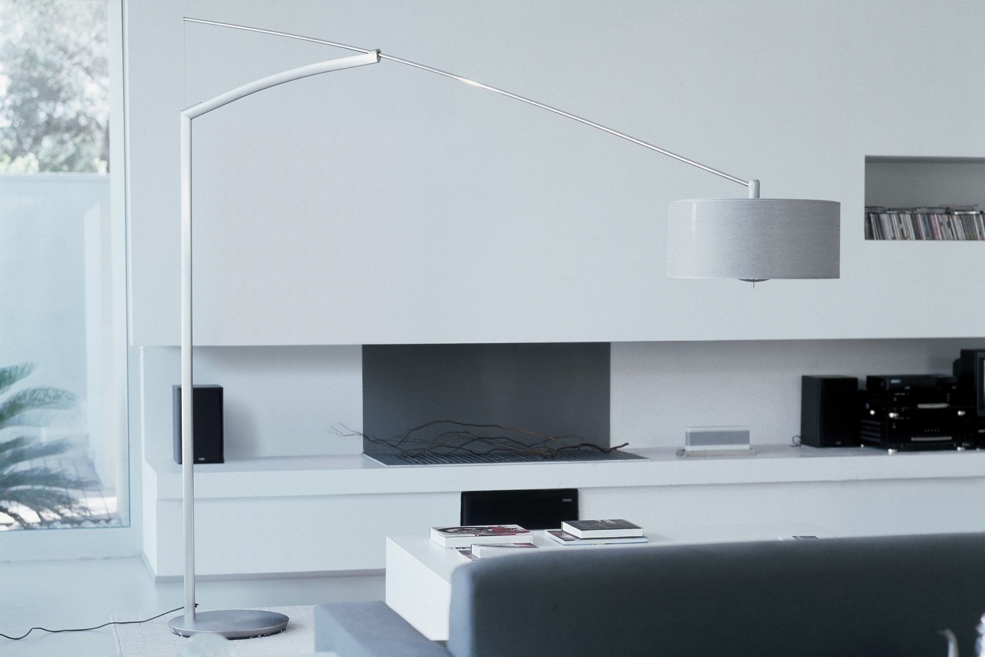 A stunning floor lamp like the Balance Floor Lamp by Jordi Viladrell for Vibia can bring a room together.