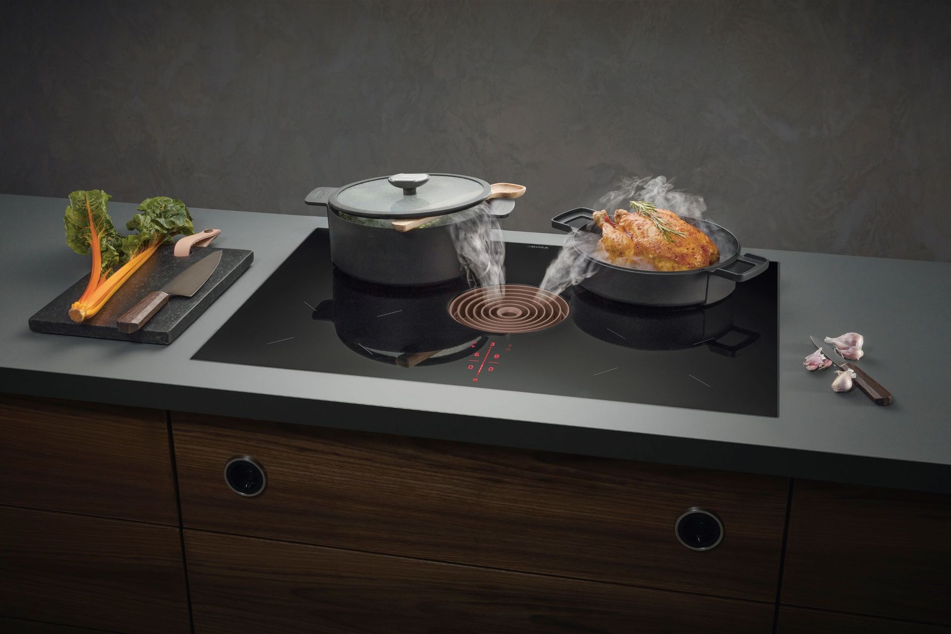 The Bora Pure Combined Cooktop and Extractor is a modern and elegant solution that sits flush against a benchtop.