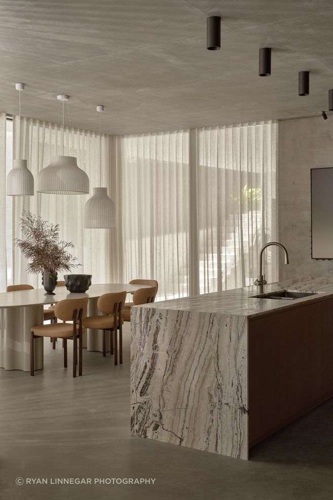 Lighting doesn't have to be matched throughout a home. Using lighting as a sculptural piece is a great way to introduce atmosphere.