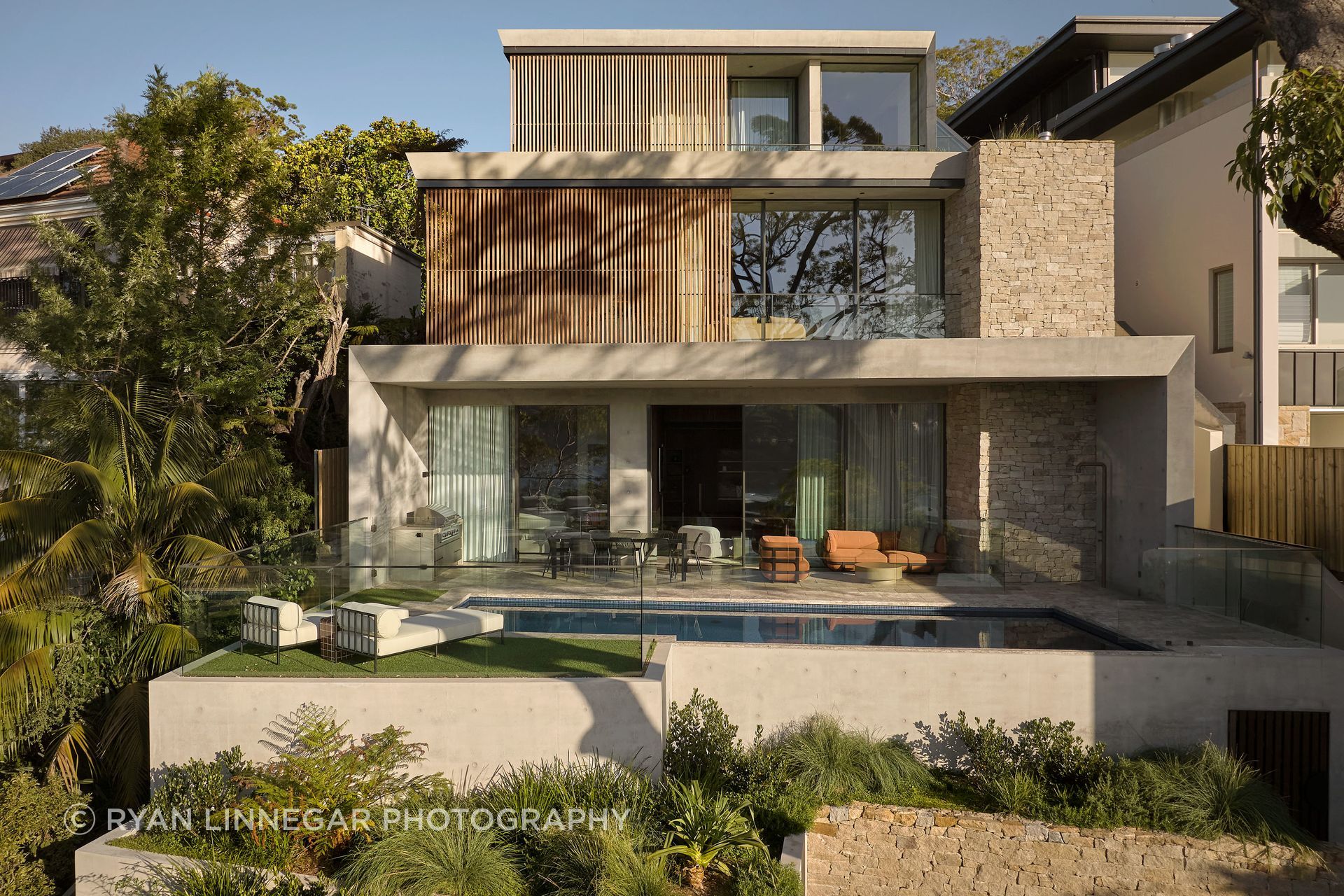 Residence Allure unfolds across four levels, with each tier stepping toward the harbour and connecting to outdoor living.