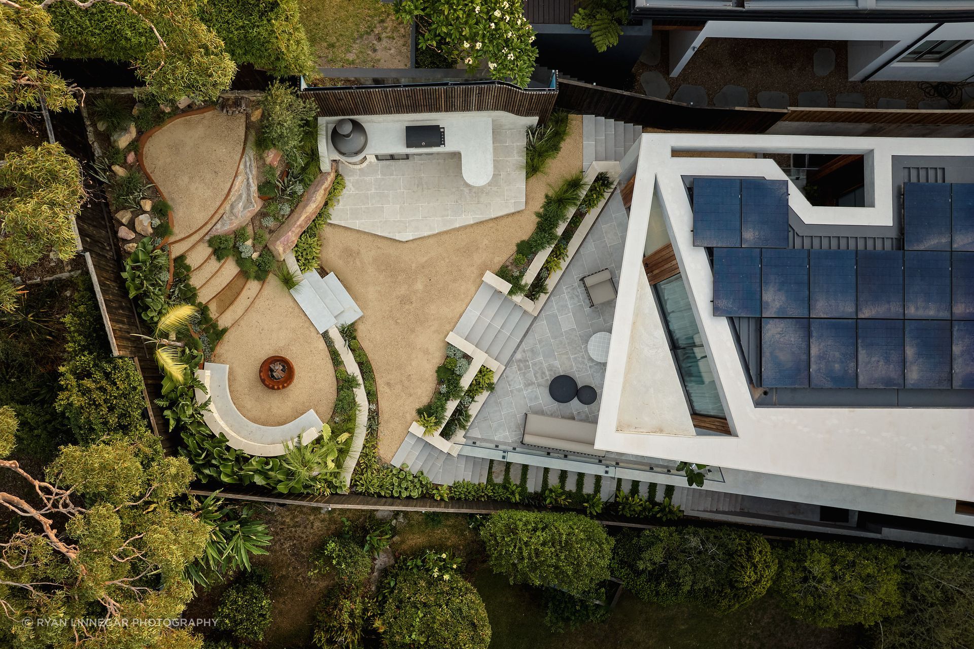 Aerial view of Residence Allure by JPWK Design. Where technicality, landscape and circulation are carefully layered to respond to the site and harbour beyond.