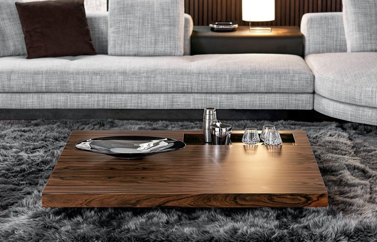 Glass and tableware can be permanent decor items for your coffee table, readily available when you need them, as seen here on the sophisticated Boteco Coffee Table by Minotti.